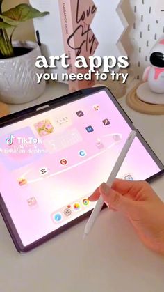 a person holding an ipad with the text art apps you need to try on it