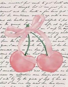 two cherries tied to a ribbon on top of a piece of paper with writing in the background