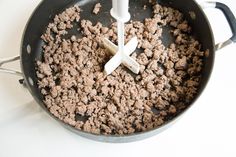 a frying pan filled with ground beef