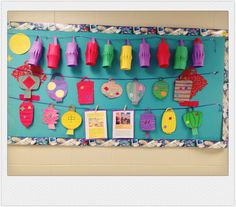 a bulletin board with clothes hanging on it