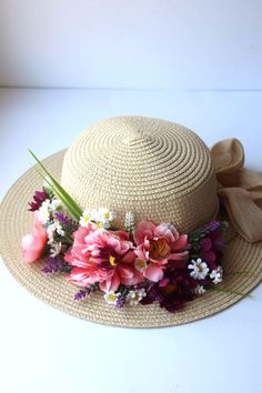 Summer hat with artificial flowers, bright floral head accessory. Elevate your summer style with this stunning hat adorned with vibrant artificial flowers. The delicate artificial flowers add a touch of elegance and charm, while the wide brim provides ample shade and protection from the sun. Whether you're lounging by the pool or strolling through a flower-filled meadow, this hat will keep you looking chic all season long.  A must-have addition to any fashion-forward woman's wardrobe. The hat fits a head diameter of 58 cm, there is a tape to adjust the size to your head. Free shipping in the USA. Thank you for visiting my shop! Enjoy. Iuliia Luxury Handmade Flower Mini Hats For Party, Sun Hat With Flowers, Pink Summer Straw Hat For Garden Party, Pink Summer Sun Hat For Garden Party, Summer Pink Straw Hat For Garden Party, Bohemian Straw Hat With Short Brim For Garden Party, Summer Beach Hats With Floral Print, Bohemian Fedora Straw Hat For Garden Party, Summer Boater Hat For Kentucky Derby Picnic