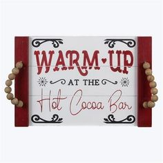 a sign that says warm up at the hot cocoa bar