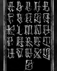 an old fashioned gothic alphabet in black and white with some type of writing on it