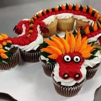 cupcakes decorated with orange and red decorations