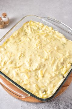 a glass casserole dish filled with yellow sauce