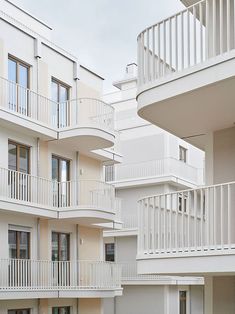 an apartment building with balconies and white balconies