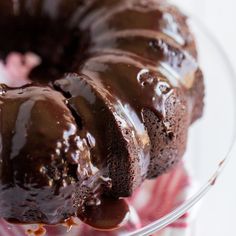 a chocolate bundt cake on a glass plate