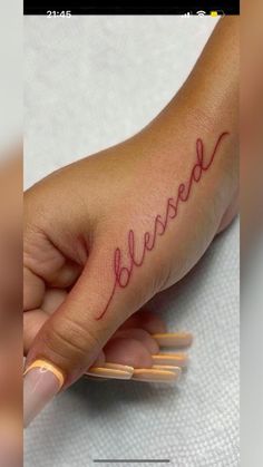 a woman's hand with the word believe written on it