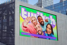 a large billboard on the side of a building in front of tall buildings with skyscrapers