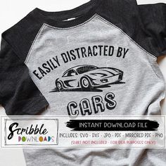 a t - shirt with the words easily distracted by cars on it and an image of a car