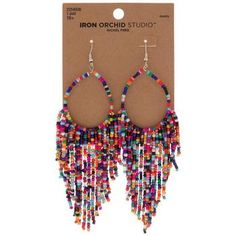 a pair of earrings with multicolored beads hanging from it's ear wires