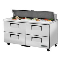 an image of a commercial kitchen prep table with food on the top and bottom drawers