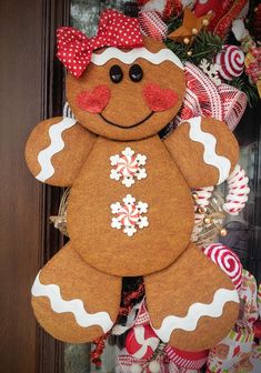 a gingerbread christmas ornament hanging on a door