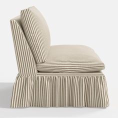 an upholstered chair with striped fabric and pleated skirting on the back