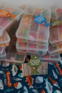 several plastic containers filled with different types of candy