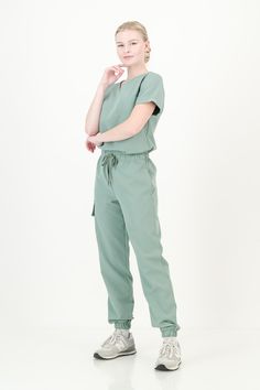 Introducing our signature style scrub set in with a Classic V-Neck scrub top and Jogger or Straight Fit scrub pants. How does it fit Top: Options for one top pocket or with additional two bottom pockets. The torso has small slits on either side of your hips, allowing for a comfortable fit. Flexi fabric that is soft, with a mild stretch. Scrubbies signature high V-neck collar. Bottom: High waisted for the feminine figure. Scrubbies signature waistband, adjustable and elasticated. Cargo pocket for Shoes To Wear With Scrubs, Scrubs Fashion, Medical Scrubs Fashion, Fit Scrubs, Scrub Style, Green Scrubs, Collar Model, Scrub Sets, Medical Scrubs