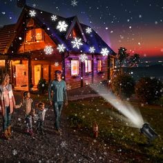 a family walking in front of a house with snowflakes on the roof