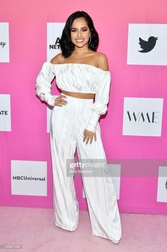 an image of a woman in white pants and crop top at the wma event