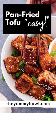 tofu in a bowl with chopsticks sticking out of it and text overlay that reads, pan fried tofu easy