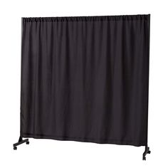 a black curtain is hanging on a white wall and it's attached to a metal frame