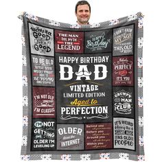 a man holding up a birthday quilt with the words on it and an image of his face