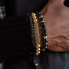 Chase your luck with the Vegas bracelet stack! The Vegas stack features trifecta of beaded beauties - black onyx, golden glitz, and rhodium PVD for a triple threat of style. Plus, a lucky dice and CZ bar for a dash of extra luck. Indulging the adventurous spirit and wandering heart that lives within all of us, our men's bracelet stacks have been crafted to provide a touch of class to your wardrobe throughout the year. Each exquistely curated stack includes a mix of spiritually healing gemstones Adjustable Gold Onyx Bracelet, Adjustable Gold Onyx Bracelets, Adjustable Black Bracelets With Gold Beads, Luxury Stackable Beaded Bangle Bracelets, Luxury Gold Jewelry With Black Beads, Luxury Adjustable Stackable Tennis Bracelet, Elegant Black Stackable Beaded Bracelets, Gold Beaded Bracelets With Onyx Gemstones, Gold Onyx Beaded Bracelets With Gemstones