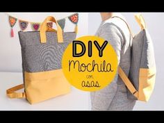 a woman carrying a gray and yellow tote bag with the words diy mochila on it