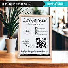 a sign that says let's get social on it next to a potted plant