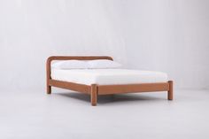 the bed is made up and ready for someone to use it in their home or office