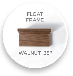 a white plate with a brown wood edge and the words float frame walnut 25 '