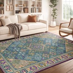 a living room filled with furniture and a large rug