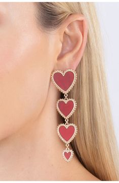 Gleaming goldtone beads frame a gradient chain of hearts on these statement drop earrings. Post back Goldtone plate, cubic zirconia Imported Jessica Rabbit Earrings, Heart Pattern Earrings, Gala Is Love Jewelry, Paul Valentine Earrings, Heart Face Earrings, Chain Of Hearts, Red Heart Earrings, Link Earrings, Heart Dangle Earrings