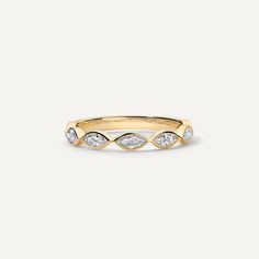 a yellow gold ring with three diamonds