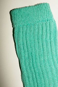 Slouchy knee high socks in a cotton/nylon blend. Thick ribbed cuff and a slim, fitted foot. Made in the USA. Available in multiple colors. Casual Fitted Knitted Socks, Fitted Knitted Socks, Ribbed Stretch Socks For Spring, Comfortable Stretch Socks With Ribbed Cuffs, Trendy Stretch Knitted Socks, Solid Ribbed Leg Warmers For Spring, Casual Soft Knee-high Socks For Spring, Casual Stretch Knitted Socks, Casual Fitted Socks With Ribbed Cuffs