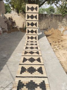 a very long rug sitting on top of a cement slab