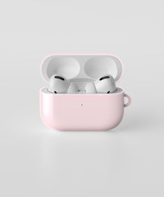 two airpods are in the pink case