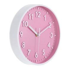 a pink and white wall clock with numbers on the face is shown against a white background