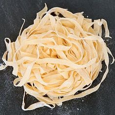 a pile of uncooked pasta sitting on top of a table