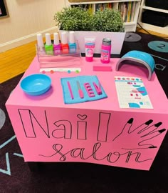 a pink table with nail polish on it