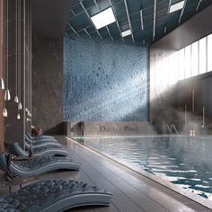 an indoor swimming pool with chaise lounges next to it and the walls are covered in rain drops