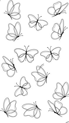 a bunch of butterflies that are drawn in black and white ink on a sheet of paper