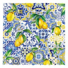 a blue and white tile with lemons on it