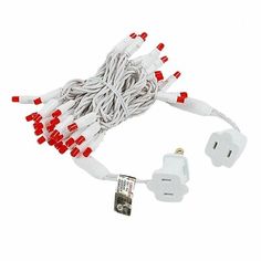 white and red christmas lights are plugged into an electrical outlet on a white background