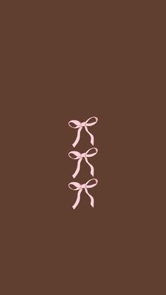 two pink bows on a brown background with the word love written below them in cursive writing