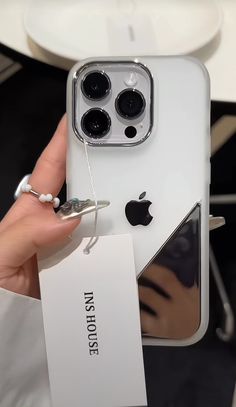 a person holding an iphone 11 pro in their hand with the case attached to it