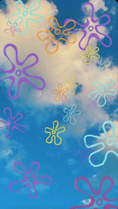 there are many different colored flowers in the sky