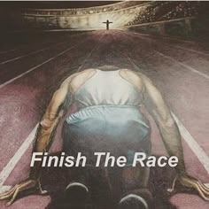 a man sitting on the ground in front of an arena with words finish the race