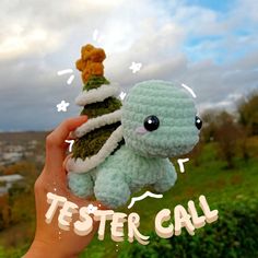 a hand holding a small stuffed animal in it's right hand with the words tester call above it