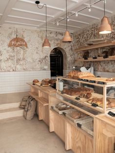 a bakery filled with lots of different types of bread