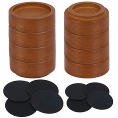 a set of six wooden coasters with black circles